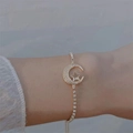 Star and moon gold bracelet with cubic zirconia on female wrist elegant lifestyle shot - Gold Star & Moon Pull-out Bracelet