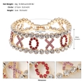 Detail of XOXO gold bracelet with red and pink rhinestones and dimension specs - Gold (XOXO Chain)