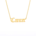 Detail of a golden Cancer zodiac pendant necklace with polished cutout lettering - Cancer (Gold)