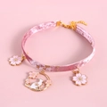 Detailed view of pink velvet pet collar featuring gold cherry blossom and cat pendants - XS (20-27cm) / Pink Velvet Sakura