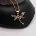 Macro shot of 14k gold dragonfly necklace with pavé cubic zirconia on black stand - Gold Dragonfly-Clear Round Zircon Main Stone