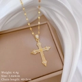 Macro detail of gold cross pendant with cubic zirconia and specifications text - Titanium Steel Chain Copper Pendant / Gold