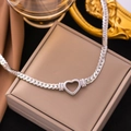 Minimalist silver heart necklace with hollow heart pendant on a stylish cuban chain - Hollow Heart Necklace / Steel