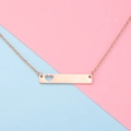 Macro detail of a rose gold bar necklace featuring a minimalist hollow heart pendant design - 16" / Rose Gold