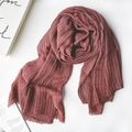 Elegant bean paste red linen scarf with textured pleats and fringe on a wooden surface - 1477 Modal Wine Red