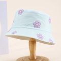Close-up of light blue kids sun hat with purple smiley flower print and neat stitching - 54cm (3-8 Years) / Light Blue