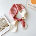 Elegant silk scarf with pink gradient floral pattern shown in a stylish knot - Jasmine with Pink