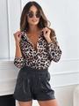Detail of autumn long-sleeved leopard print shirt paired with black faux leather shorts - S / Leopard Print