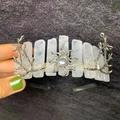Detail showing natural white crystal crown with metal sun and branch accents - Clear Quartz + Sun + Branch
