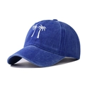Close-up of coconut tree embroidery on a vintage washed blue cotton baseball cap - Sapphire Blue