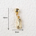 Detail view of a gold peanut pendant with 18mm height and 4mm width measurements - Gold Peanut Shell Pendant