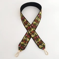 Detail of floral embroidery on wide black bag strap with gold metal lobster clasps - Small Red Flower