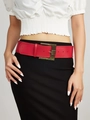 Close-up of a wide red faux leather belt with a vintage bronze buckle on model - 5.8CM Wide / Red
