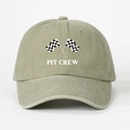 Close-up of the vintage washed cotton texture and Pit Crew embroidery on the racing cap - Light Khaki