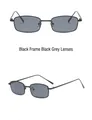 Detail view of narrow black rectangular metal frame sunglasses with dark grey lenses - Black Frame Grey Lens