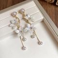 Detail of floral earrings with gold chains, white pearls and iridescent flower petals - Gold-White (Style 25)