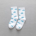 Mid-cut white cotton socks with blue cloud patterns on a textured grey fabric surface - One Size / White