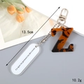 Detail shot of resin letter Z keychain with tortoise pattern and silver lobster clasp - Letter Z