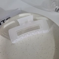 Minimalist rectangular hollow hair claw clip in matte white finish on ceramic plate - Square Matte White