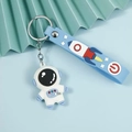Cartoon Astronaut Schlüsselanhänger mit weißer Silikonfigur und hellblauem Armband - Weltraumfahrer--Blau