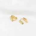 Macro shot of gold-plated 18K converters for non-pierced ears on white fabric - Type 4 Needle Triangle Clip Converter 18K Gold