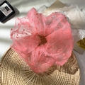 Pink polka dot tulle scrunchie hair tie on a woven tray with a fresh aesthetic - Fuchsia