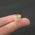 Detailed close-up of a four-layer gold ear cuff with sparkling pavé zircon stones - Size 7 / Gold
