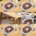 Close-up of Christmas placemats and table runner with festive wreath and red bow patterns - Knitted Wreath
