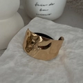 Wide golden cuff bracelet featuring a textured hammered metal finish on a white stone base - Hammered Wide Arc / 0630-Gold
