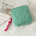Quilted green gingham cosmetic bag with orange zipper and pink cord knot detail - Green Checkered