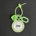 Poker chip keychain featuring light green Monte Carlo 200 chip and transparent dice - Light Green Chip 200 With Green Dice Keychain (CS001-200)