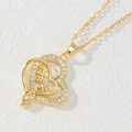 Detail of gold double heart pendant necklace with MAMA lettering and white zircon pavé - Double Heart MAMA/Multicolor Zirconia Setting