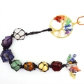 Detailed close-up of natural 7 chakra crystal stones in hand-woven black net with Tree of Life - Gold Slanted Tree Woven Pendant