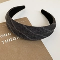 Close-up of dark grey striped fabric headband with white dotted texture on craft paper - Headband / Gray