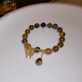 Tiger eye beaded bracelet with a golden butterfly charm and shimmering crystals - Tiger Eye Color Zircon Butterfly Bracelet (50# Bracelet - Brown - Butterfly)