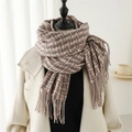 Detail of pink and brown plaid scarf with tassels on a white coat with natural light - Dusty Pink