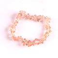 Handmade stretch bracelet featuring light orange natural crystal crushed stone chips - Elegant Pink Glass