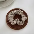Elegant champagne satin scrunchie with a silky texture and glossy finish for ponytails - Small 7cm / Milk Coffee