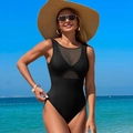 Sleek black one-piece swimsuit with mesh panels and straw hat in sunny beach setting - Black