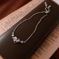 Detail of adjustable silver box chain bracelet with sparkling zircon heart charm on retro box - Silver Bow Heart Bracelet