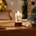 Kaars rode kerstman met cadeau (watergevuld)