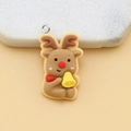 DIY brown resin Christmas reindeer charm with silver metal ring on beige background - Reindeer with Pin