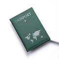 Detail showing the dark green faux leather texture and stitching of this travel passport cover - Dark Green
