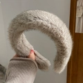 Cold grey faux mink fur headband with thick plush texture shown held by hand - Wide Headband / Gray