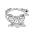 Close-up of silver bow ear cuff featuring sparkling pavé crystals and centered round gem - EGJ0009 Silver