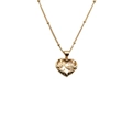 Close-up of gold heart pendant necklace with MOM lettering and zircon stones for Mother's Day - MOM Heart Single Zirconia