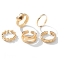 Set of 5 gold-toned gothic rings featuring heart and woven band designs on white background - Heart Ripple Gold 5-Piece Set (5324801)