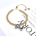 Adjustable golden beaded bracelet featuring a silver balloon letter Z charm for women - Letter Z