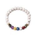 7 Chakra stone beaded bracelet with white lava rocks and golden crown accents on white background - White Chakra