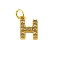 Sparkling gold letter H pendant necklace with clear pavé crystal stones on white background - Letter H